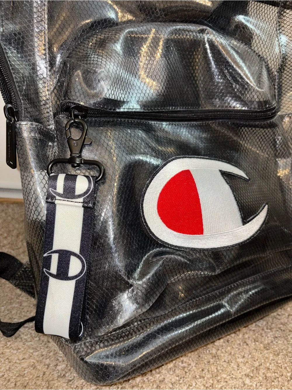 Champion Black Vinyl Backpack with Red & White Logo Patch